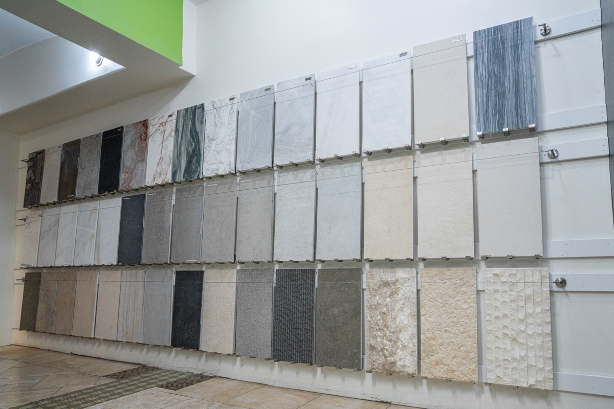 Natural stone slabs with rich veining, representing marble, travertine, and quartzite selections